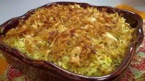 Easy chicken Rice-A-Roni casserole topped with crispy fried onions in a baking dish.