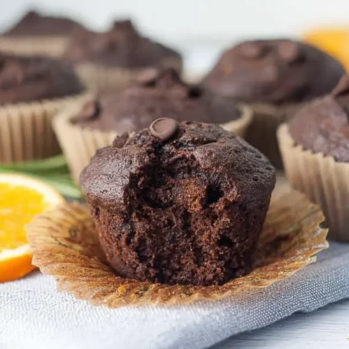 Inside crumb of Sourdough Zucchini Muffins showing moist chocolate texture
