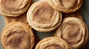 churro cookie recipe featuring plain chewy cookies coated in cinnamon sugar with soft indented centers, overhead view