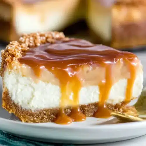 Caramel Cheesecake Tort Recipe: Simple, Luxurious close-up of a caramel-topped slice on a plate.