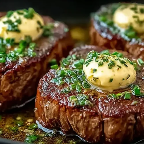 Pan Seared Steak with Garlic Butter: Amazing, Juicy Finish 2 Pan Seared Steak with Garlic Butter served in a pan with three seared steaks topped with garlic herb butter, parsley, and glossy pan juices