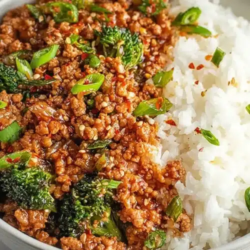 Firecracker Ground Chicken Bowl: Quick, Stunning Skillet Dinner 3 Firecracker Ground Chicken Bowl served with spicy ground chicken, broccoli, sesame seeds, green onions, and steamed white rice