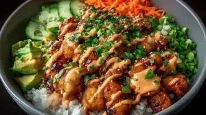Delicious Bang Bang Chicken Bowl filled with vibrant vegetables and rich sauce.