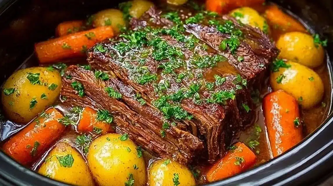 Delicious crockpot beef pot roast served with vegetables