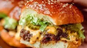 Big Mac sliders with lettuce, cheese, and special sauce on a serving platter.