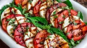 Delicious Caprese salad with tomatoes, mozzarella cheese, and fresh basil leaves