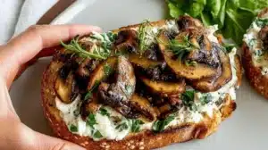 Creamy Mushroom Toast (Quick Lunch or Light Dinner) Creamy mushroom toast with herbs on a rustic plate