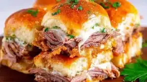Delicious French Dip Sliders served with a side of au jus for dipping