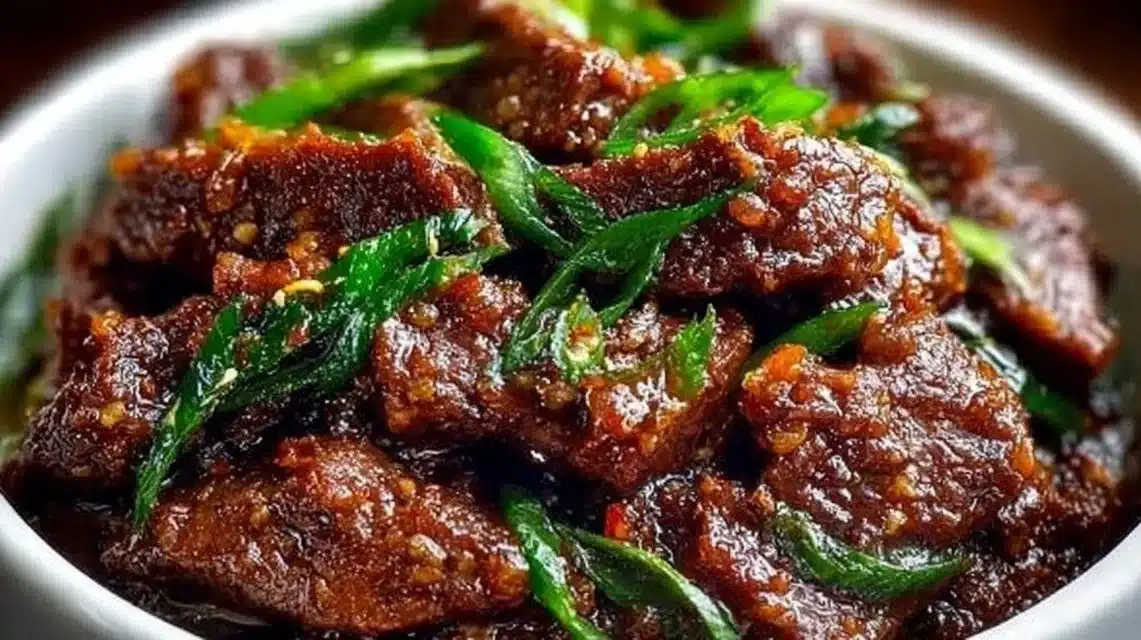 Tender Slow Cooker Mongolian Beef served with rice and vegetables