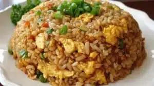 Homemade Easy Fried Rice Made in Minutes Bowl of easy homemade fried rice with vegetables and egg.