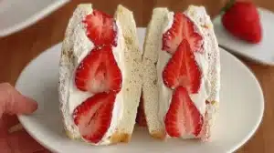 Delicious Japanese strawberry sandwich featuring fresh strawberries and cream.