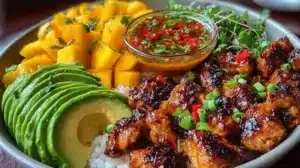 BBQ chicken mango bowl served in a vibrant dish with fresh mango and grilled chicken.