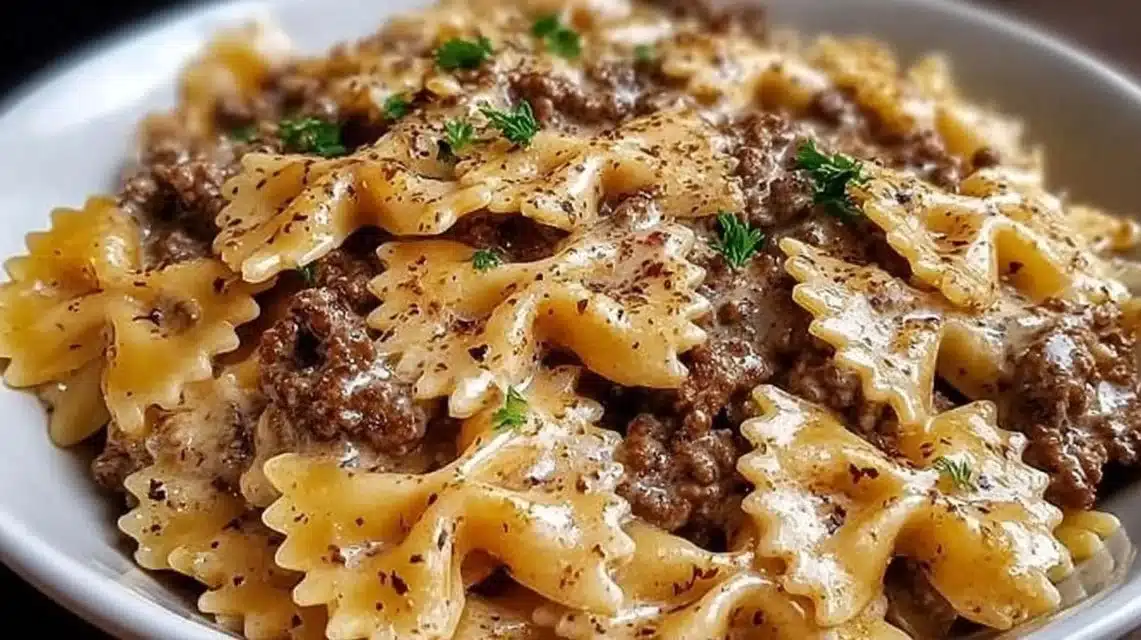 Creamy Parmesan Garlic Beef Bowtie Pasta topped with fresh herbs and cheese