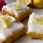 A delicious plate of homemade lemon brownies with a zesty glaze.