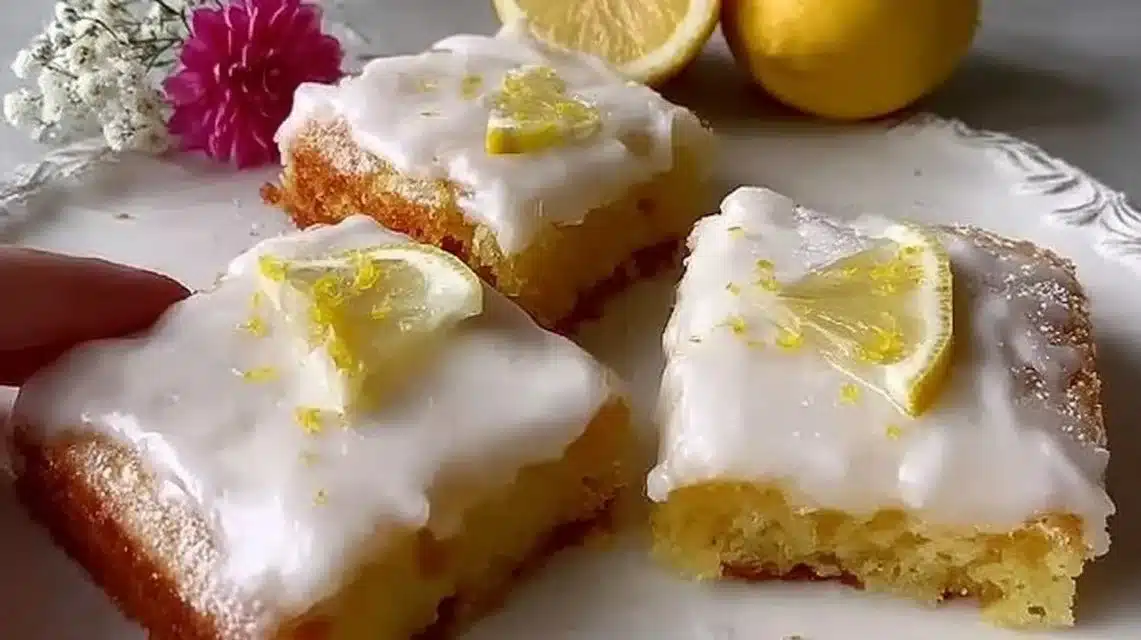 A delicious plate of homemade lemon brownies with a zesty glaze.