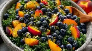 Delicious Peach Blueberry Kale Salad with vibrant colors and healthy ingredients.
