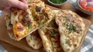 Delicious Butter Chicken Flatbread topped with tender chicken and creamy sauce
