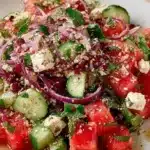 Chilled watermelon feta salad with cucumber and fresh mint leaves